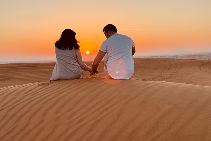 Dubai Evening Desert Safari with Camel Ride, Sandboarding & BBQ Dinner