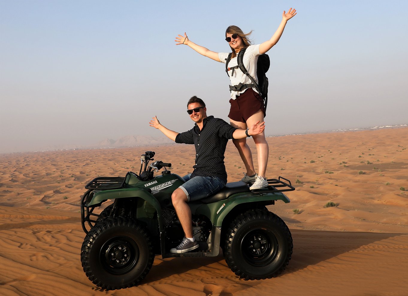 Dubai Evening Desert Safari with Quad Biking, Dune Bashing, Camel Ride & BBQ Dinner