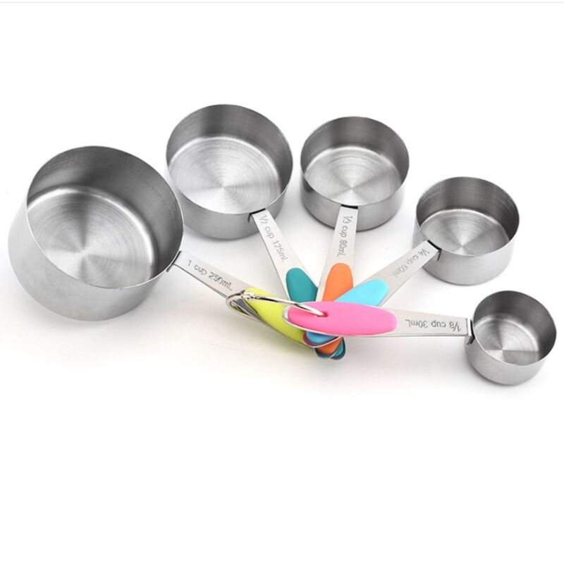 Stainless steel baking tools with measuring cups and spoons